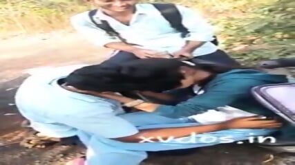 Collage Girl Having Kissing Session With Friend Infront Of Other Friends